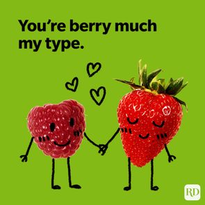 Anthropomorphic raspberry and strawberry hold hands, surrounded by hearts, on a green background. Text reads: 