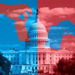 Hands place ballots against a divided red and blue U.S. Capitol, symbolizing political division. Cloudy sky above and trees on the sides.