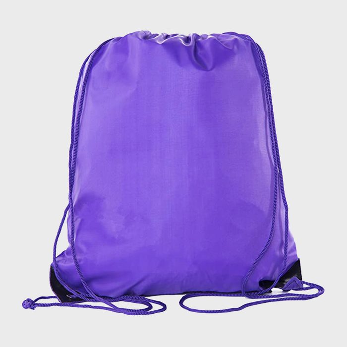 A purple drawstring backpack rests against a plain white background.