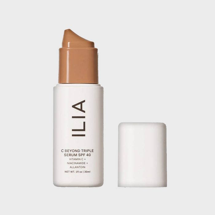A beige-topped cosmetic bottle, labeled 