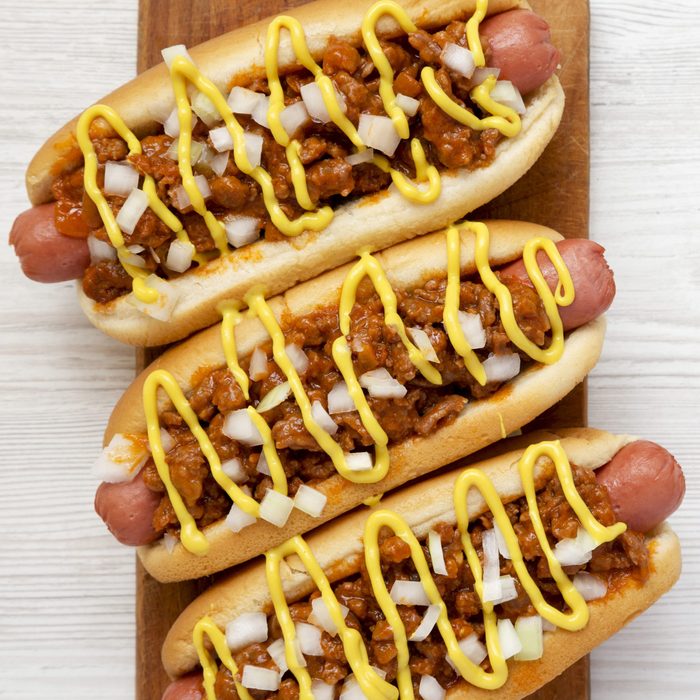 hot weiner with meat sauce, mustard and onions