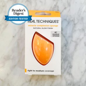 Orange makeup sponge packaged in a box, labeled 