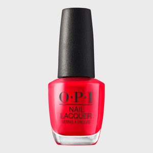 A red nail polish bottle with black cap stands upright, displaying 