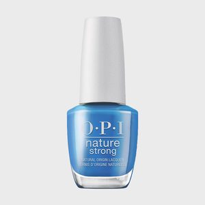 A bottle holds blue nail polish, labeled 