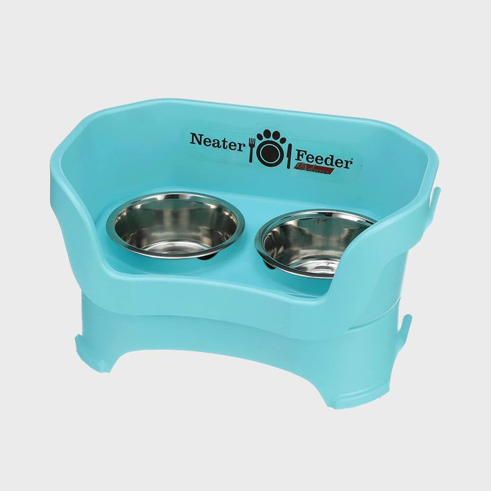 Elevated pet feeder holds two stainless steel bowls, surrounded by turquoise plastic, featuring 