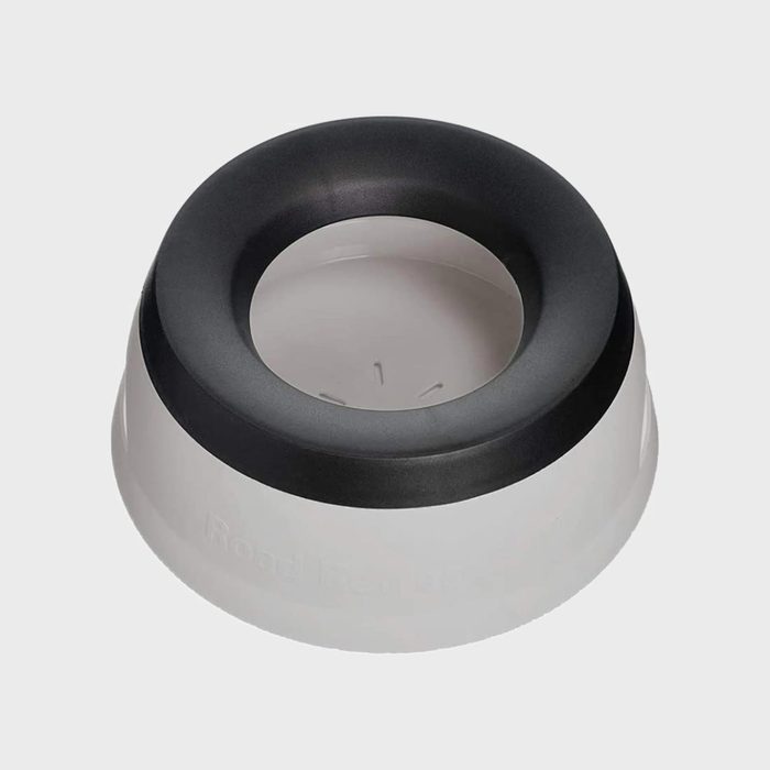 Bowl with wide black rim sits empty on a plain gray surface.