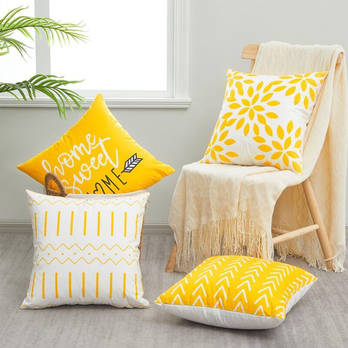 Pillows rest in varying positions; one reads 