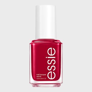 Red nail polish bottle standing upright, labeled 
