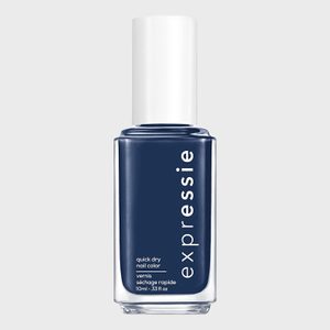 Nail polish bottle stands upright; deep blue color labeled 
