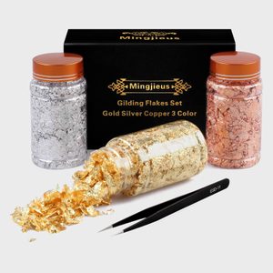 Jar spills gold flakes beside closed jars, accompanied by tweezers, against a box labeled 