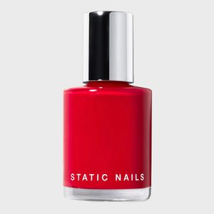 A red nail polish bottle labeled 