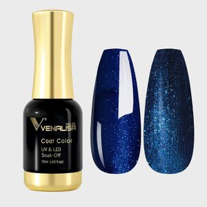 Nail polish bottle stands upright beside two blue glitter-coated swatches, displayed against a plain background. Text reads: 