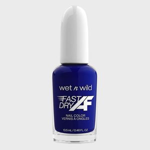 A blue nail polish bottle stands upright; text reads 