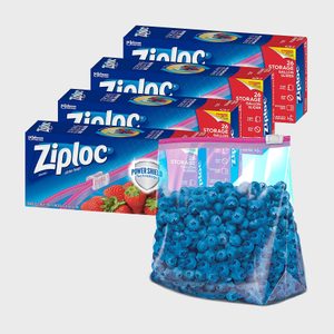 Ziploc slider bags hold blueberries, surrounding three boxes labeled for storage. Bright blue packaging features strawberries and text promoting 