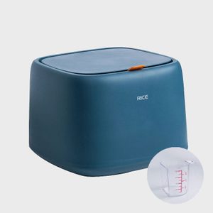 A blue rice storage container sits on a plain background, featuring a measurement cup inset. 