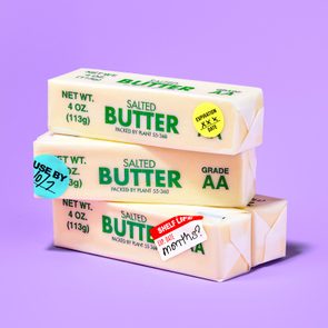 Butter sticks stacked, displaying labels 