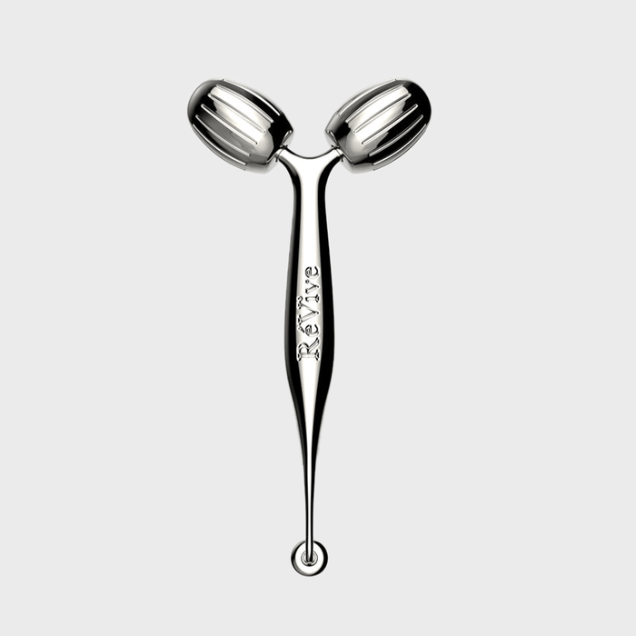 Metal facial roller with two ribbed rollers; engraved 
