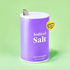Salt container sits with an open spout, labeled 