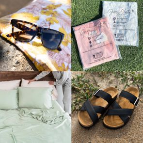 Sunglasses rest on a floral towel; eco-friendly bags lie on grass; bedding is being adjusted; sandals are placed on sandy ground near plants.