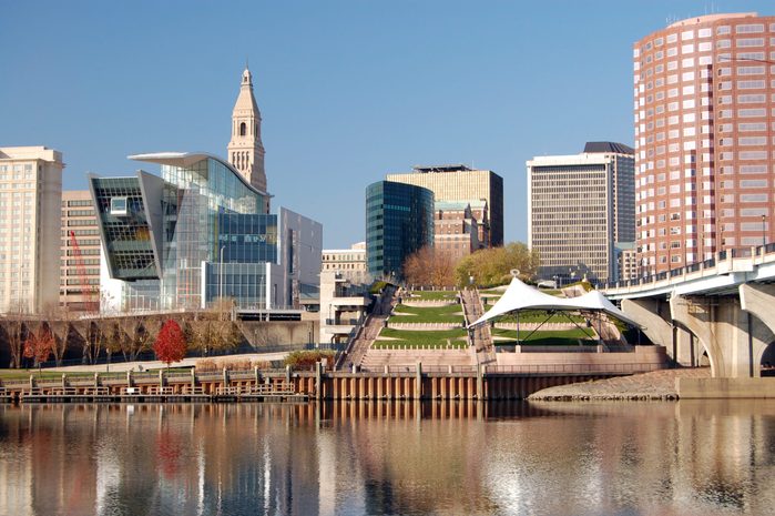 Hartford, Connecticut skyline on an autumn day. Connecticut River in the foreground.