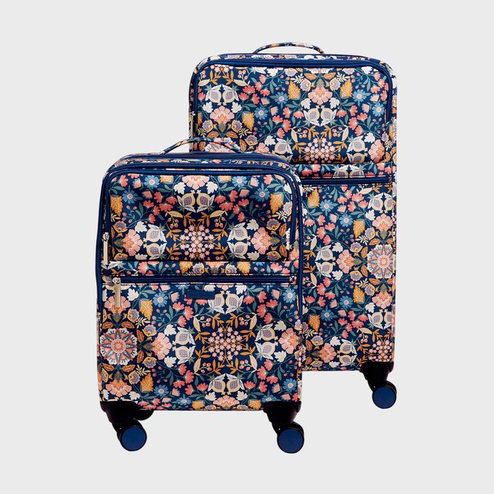 Two floral-patterned suitcases stand upright on wheels against a plain background, displaying colorful intricate designs.