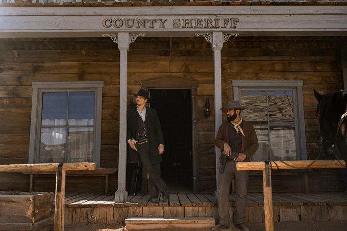 Walker Independence -- “Pilot” -- Image Number: WID101b_0252r -- Pictured (L-R): Greg Hovanessian as Tom Davidson and Philemon Chambers as Augustus -- Photo: Anna Kooris/The CW -- © 2022 The CW Network, LLC. All Rights Reserved.