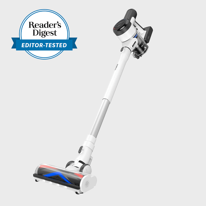 Vacuum cleaner angled, displaying cleaning function, featured on a plain background. Badge reads 
