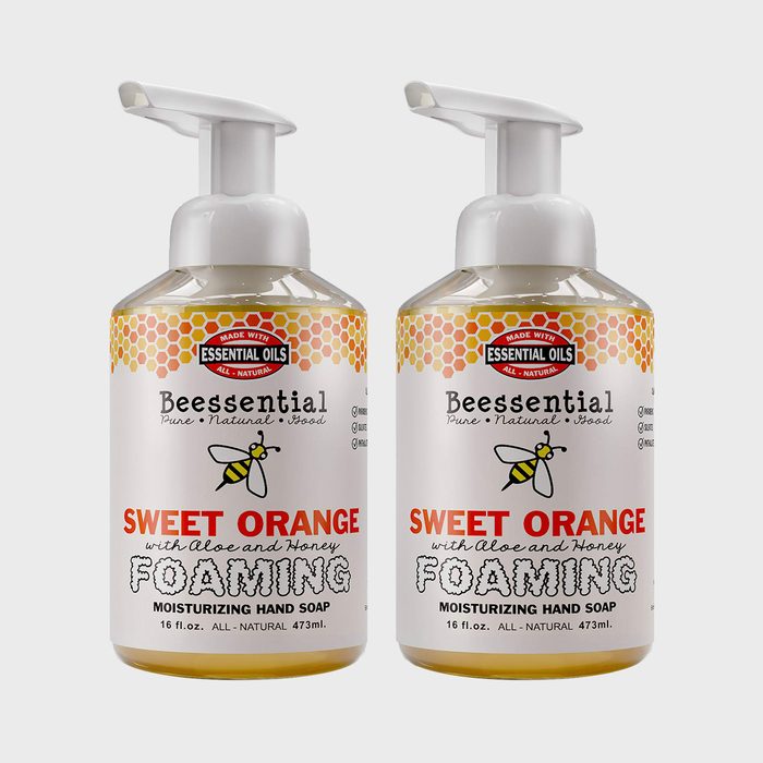 Two pump bottles of Beessential Sweet Orange foaming hand soap with bee label, phrase 