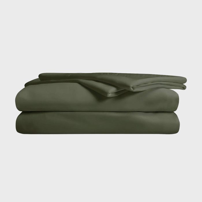 Dark green bed sheets neatly folded on a light gray background.