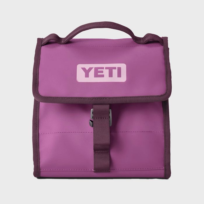 Purple lunch bag features a handle and buckle, labeled 
