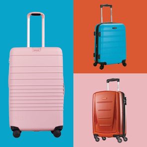 Three colorful suitcases with extended handles stand upright; a large pink on blue, small blue on orange, and medium red on pink background.