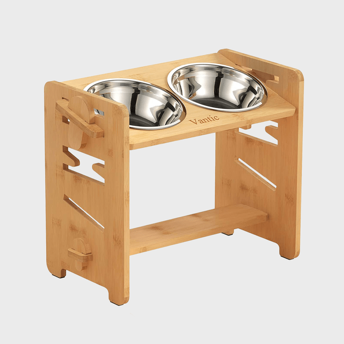 Two stainless steel bowls sit in a wooden stand labeled 