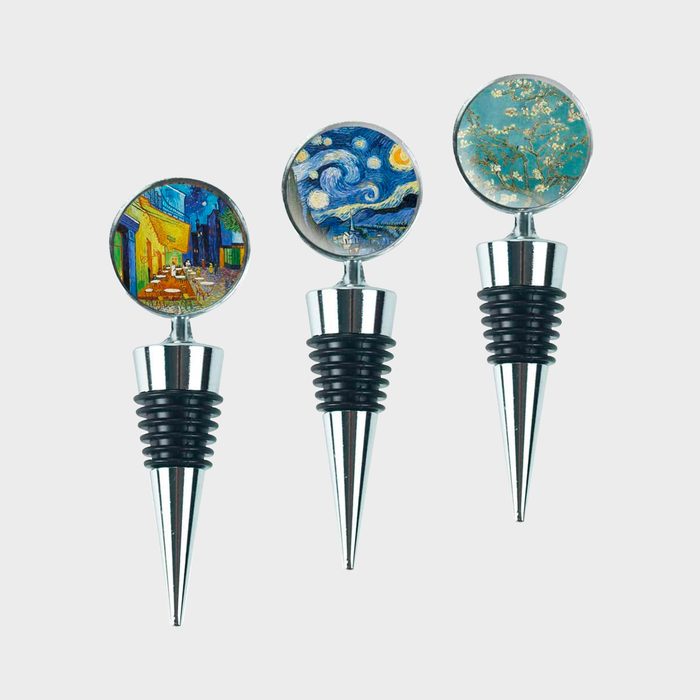 Three wine stoppers showcasing Van Gogh paintings, set against a plain background.