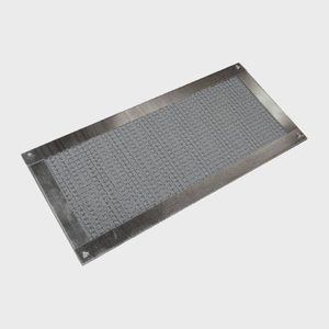 Rectangular metal grate with textured surface lies on a plain light gray background, featuring a grid pattern within a bordered frame.