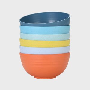 Stacked bowls in various colors create a tower; displayed against a plain, white background.