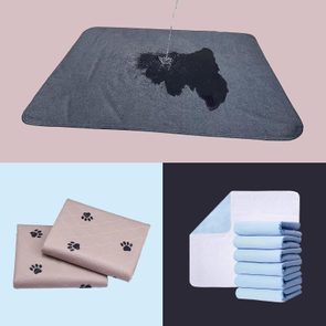 Gray absorbent mat deflects liquid, surrounded by folded beige paw-print and blue-white layered pads against pastel backgrounds.