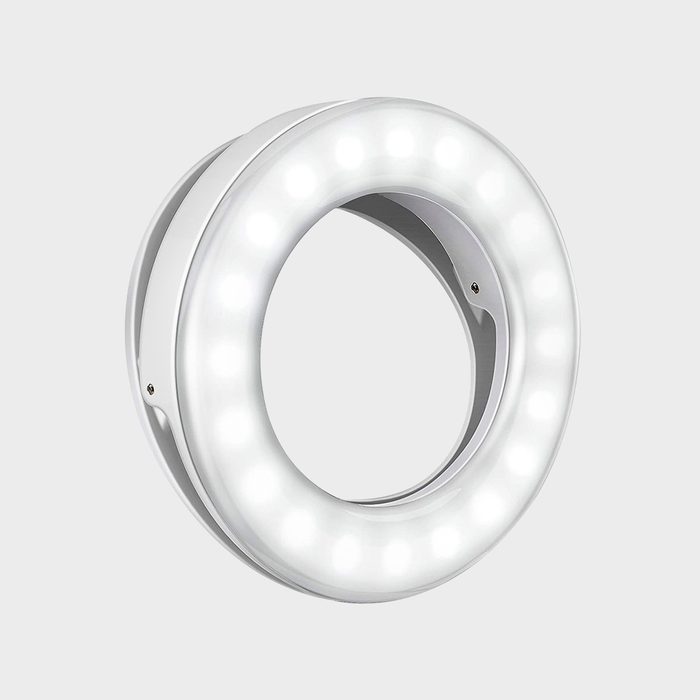 A circular ring light glows brightly, displaying multiple LEDs evenly spaced, set against a neutral gray background.