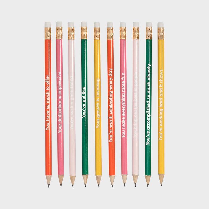 Pencils display supportive phrases, standing upright in a row, featuring various colors like red, pink, green, and yellow against a plain white background.