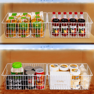 Wire baskets hold pasta, bottles, and canned goods in a well-lit pantry with wooden shelves.