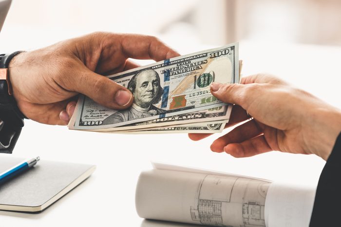 Transfer of money from hand to hand.
