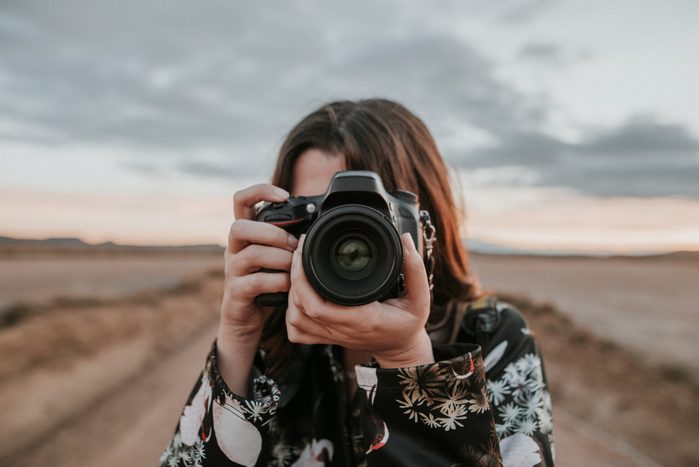 Young woman taking a picture