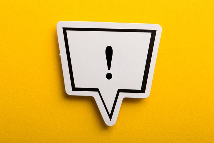 Exclamation Mark Speech Bubble Isolated On Yellow