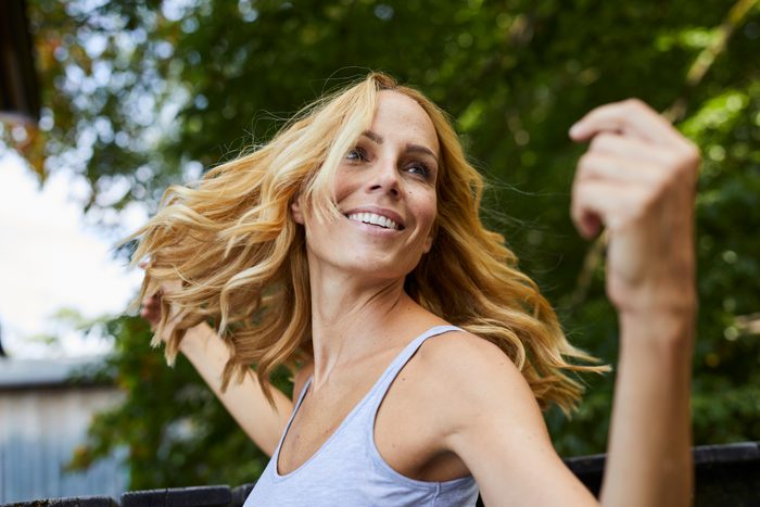 Carefree blond woman outdoors