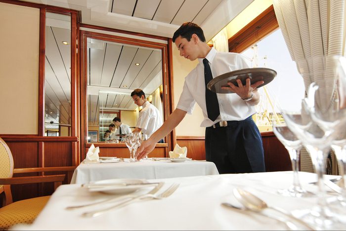 Waiter laying the table