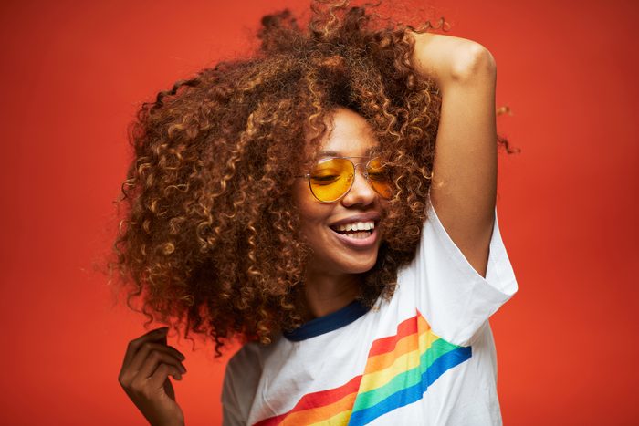 Beautiful young woman with afro, Reggaeton musician.