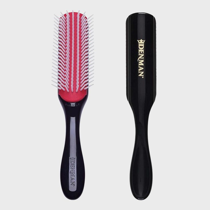 Hairbrush displayed front and back; black handle, red base, white bristles, contextless background. Text reads 