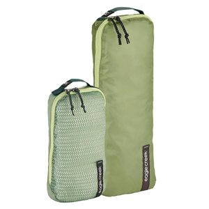 Two green packing cubes with mesh and solid panels stand upright, displaying logos 