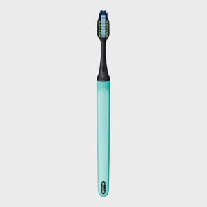 Toothbrush standing upright; features a black and turquoise design. Text: 