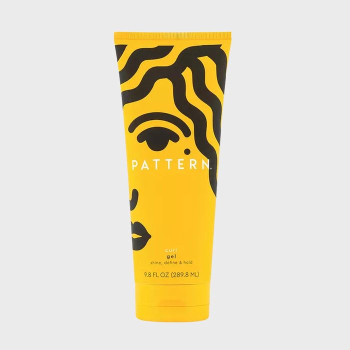 Yellow tube with black abstract face design, standing upright. Text reads: 
