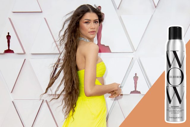 A person poses in a bright yellow dress on a red carpet; a hairspray can with 